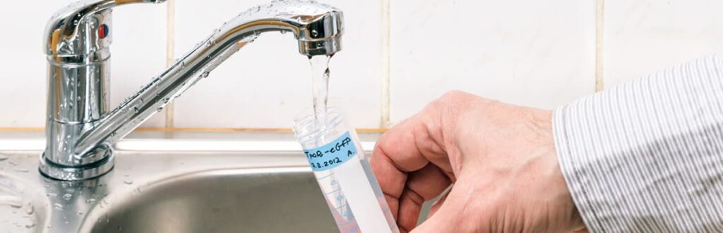 Image of collecting a water sample from a tap