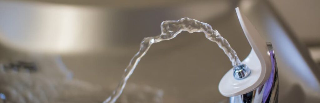 Up close image of a water drinking fountain