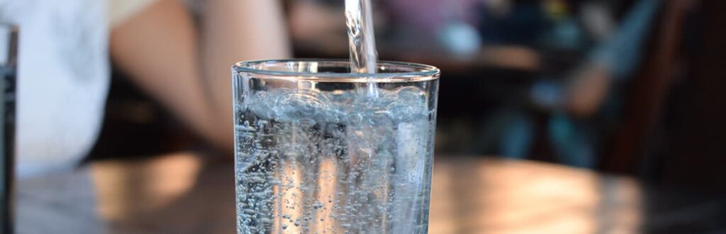 Water pouring into a glass