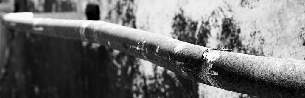 Black and white image of a lead pipe