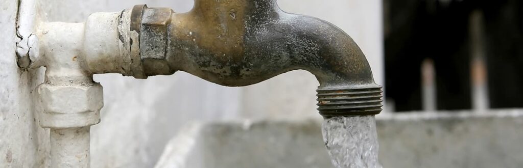 Water running from an outdoor faucet/spigot