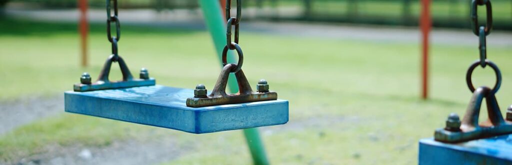 Playground equipment including a swing set