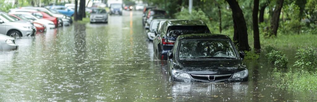 Flooded Suburban Steet With Cars Half Under Water