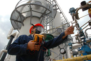 Worker at an industrial suit wearing PPE