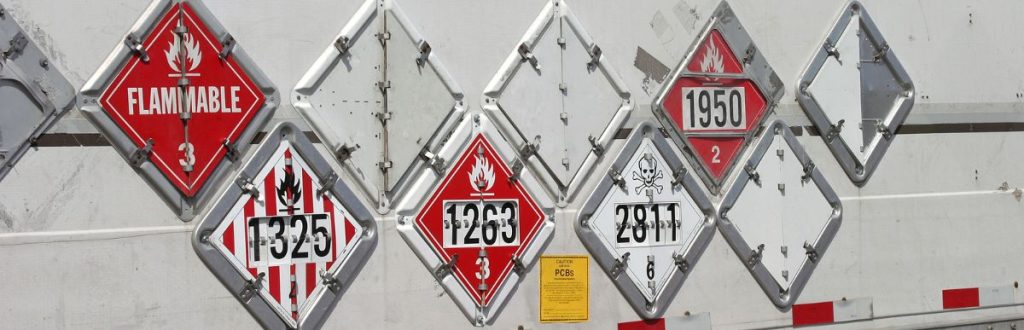 Hazardous Materials sign posts to help people understand what the business is hauling